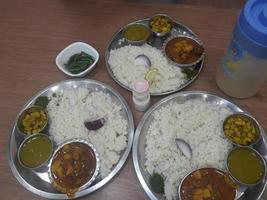 Traditional food of Bangladesh is rice and curry photo