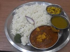 Traditional food of Bangladesh is rice and curry photo