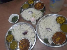 Traditional food of Bangladesh is rice and curry photo