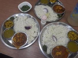 Traditional food of Bangladesh is rice and curry photo