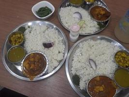 Traditional food of Bangladesh is rice and curry photo