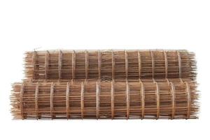 Stack of Steel mesh rolls that rust for building structure in the construction site isolated on white background. photo