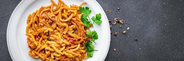 noodles with vegetables tomato sauce ready to eat healthy meal food snack on the table copy space food background rustic top view veggie vegan or vegetarian photo