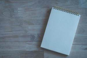 school notebook paper  on wooden table background photo