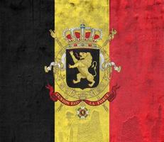 Flag of Belgium on a textured background. Concept collage. photo