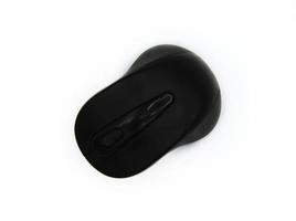 Top view of black wireless or Bluetooth computer mouse isolated on white background with clipping path. Flat lay of input Device or Electronic tool for using with computer or laptop and Technology. photo