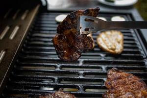 pork neck grilled on a gas grill. Closeup photo