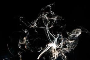 Smoke effect texture. Isolated background. Black and dark backdrop. Smokey fire and mistic effect. photo