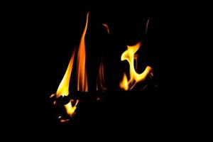 Fire flame texture. Burning material backdrop. Burn effect pattern. Blaze and torch wallpaper. Heat and haze backdrop. photo