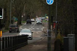 Low Angle View of British Road and Traffic at Luton Town of England UK. The Image Was Captured at Central Luton  City During a Cold and Cloudy Evening of 01-April-2023 photo