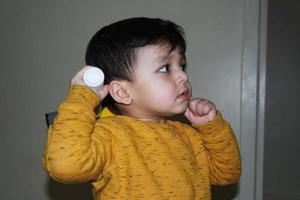 Cute Asian Pakistani Baby, Ahmed Mustafain Haider is Posing at Home. Originally he is from Pakistan but Live at Luton England UK. Image was Captured on 25-March-2023 photo