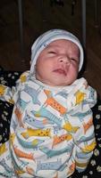 New Born Asian Pakistan Baby Boy is Relaxing. He is Named Azlan Ahmed Shah, Born on 14-March-2023 at Luton and Dunstable Hospital at Luton England UK. Image Captured on 20-March-2023 photo