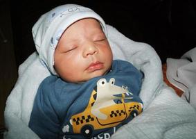 New Born Asian Pakistan Baby Boy is Relaxing. He is Named Azlan Ahmed Shah, Born on 14-March-2023 at Luton and Dunstable Hospital at Luton England UK. Image Captured on 20-March-2023 photo