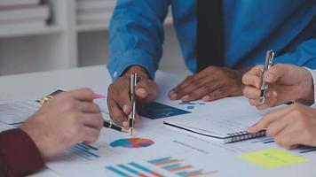 Financial analysts analyze business financial reports on a digital tablet planning investment project during a discussion at a meeting of corporate showing the results of their successful teamwork. video