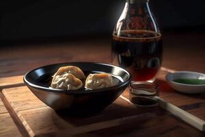 Japanese dumplings in a plate and soy sauce. photo