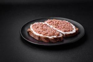 Delicious sandwiches consisting of grilled toast, canned tuna and cream cheese photo