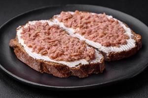 Delicious sandwiches consisting of grilled toast, canned tuna and cream cheese photo