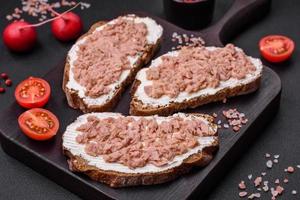 Delicious sandwiches consisting of grilled toast, canned tuna and cream cheese photo