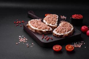 Delicious sandwiches consisting of grilled toast, canned tuna and cream cheese photo