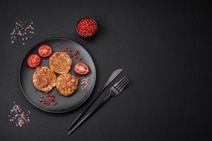 Delicious fresh fried minced fish cutlets with spices and herbs photo