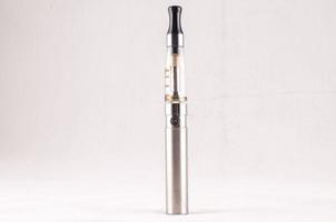 Electronic cigarette on white background photo