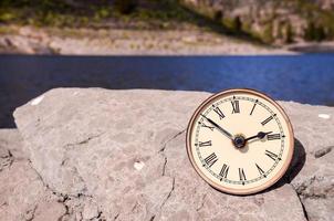 Clock on a rock photo