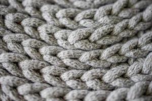 interesting background made of crochet hand-made, gray cotton cord photo