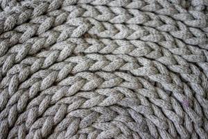 interesting background made of crochet hand-made, gray cotton cord photo