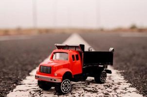 Toy truck on the road photo