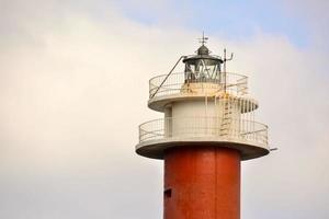 Lighthouse by the sea photo