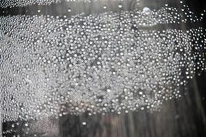 out of focus water drops in closeup creating bokeh background photo