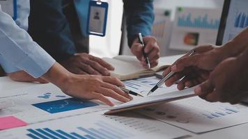 Financial analysts analyze business financial reports on a digital tablet planning investment project during a discussion at a meeting of corporate showing the results of their successful teamwork. video