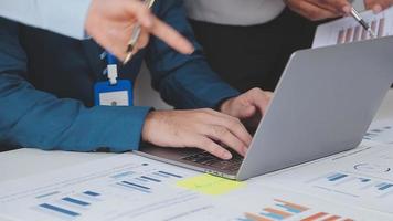 Financial analysts analyze business financial reports on a digital tablet planning investment project during a discussion at a meeting of corporate showing the results of their successful teamwork. video