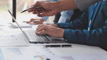 Financial analysts analyze business financial reports on a digital tablet planning investment project during a discussion at a meeting of corporate showing the results of their successful teamwork. video