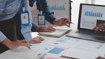 Financial analysts analyze business financial reports on a digital tablet planning investment project during a discussion at a meeting of corporate showing the results of their successful teamwork. video