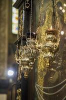 Beautiful censers hanging above the large icon in the Church photo