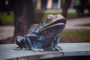 metal frog from the fountain on the market square in Lebork, Poland in close-up photo