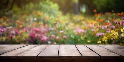 Empty wooden table in flowers garden blurred background, Free space for product display. photo