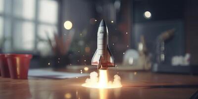 Business start up concept with rocket launching in workplace. photo