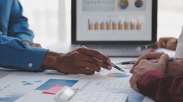 Financial analysts analyze business financial reports on a digital tablet planning investment project during a discussion at a meeting of corporate showing the results of their successful teamwork. video