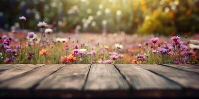 Empty wooden table in flowers garden blurred background, Free space for product display. photo