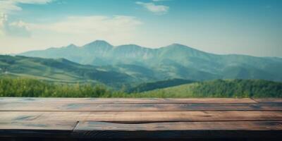 Empty wooden table with green mountain background, Free space for product display. photo