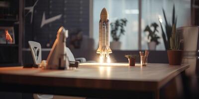 Business start up concept with rocket launching in workplace. photo