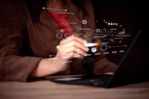 Businesswoman using computor with digital business interface on screen. digital transformation change management, new technology bigdata and business process strategy. photo
