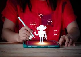 Smart woman using tablet with artificial intelligence icon on screen. Technology and innovation concept. convesation with AI. photo