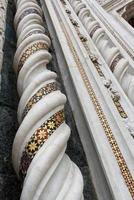 Orvieto, Italy, September. Column adorned with mosaic at the facade of the Cathedral of Orvieto. Cathedral of Santa Maria Assunta Orvieto, Umbria. Italy. photo