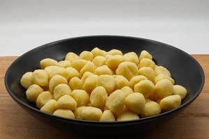 Fresh raw uncooked Italian Gnocchi di patate, Potato Gnocchi. photo