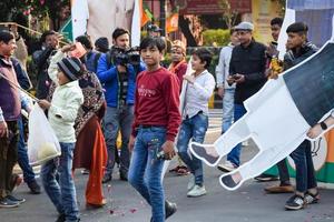 New Delhi, India - January 16 2023 - Thousands of people collected during Prime Minister Narendra Modi BJP road show, people during PM Modi big election rally in the capital photo