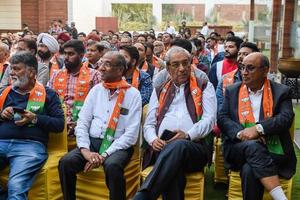 Delhi, India, March 02 2023 -Bharatiya Janata Party - BJP supporter during mega road show in support of BJP candidate Pankaj Luthara to file nomination papers ahead of MCD local body Elections 2022 photo