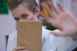 short haired woman reading walk in the fresh air education photo